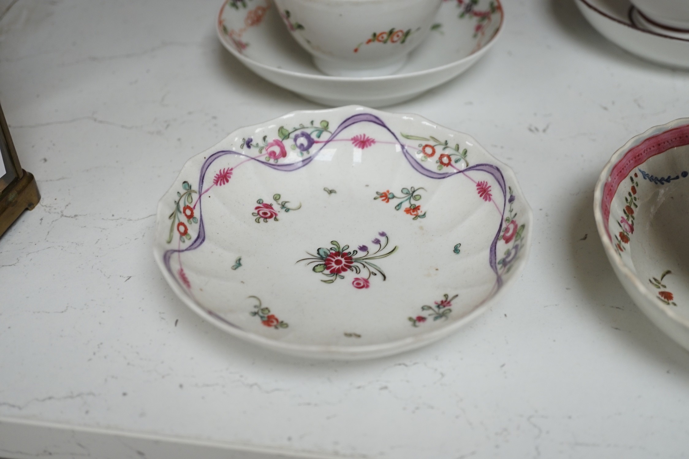 A quantity of Newhall teabowls and saucers and a pearlware tea bowl and saucer, c.1790-1800